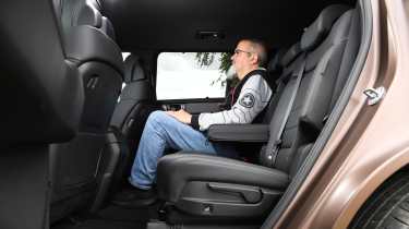 Auto Express senior test editor Dean Gibson sitting in the Hyundai Santa Fe's middle row seats
